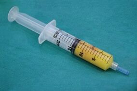 Syringe with fatty tissue for penis enlargement surgery